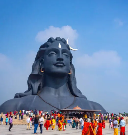 A beautiful statue of Lord Shiva stands before a congregation emanating almighty power and grace