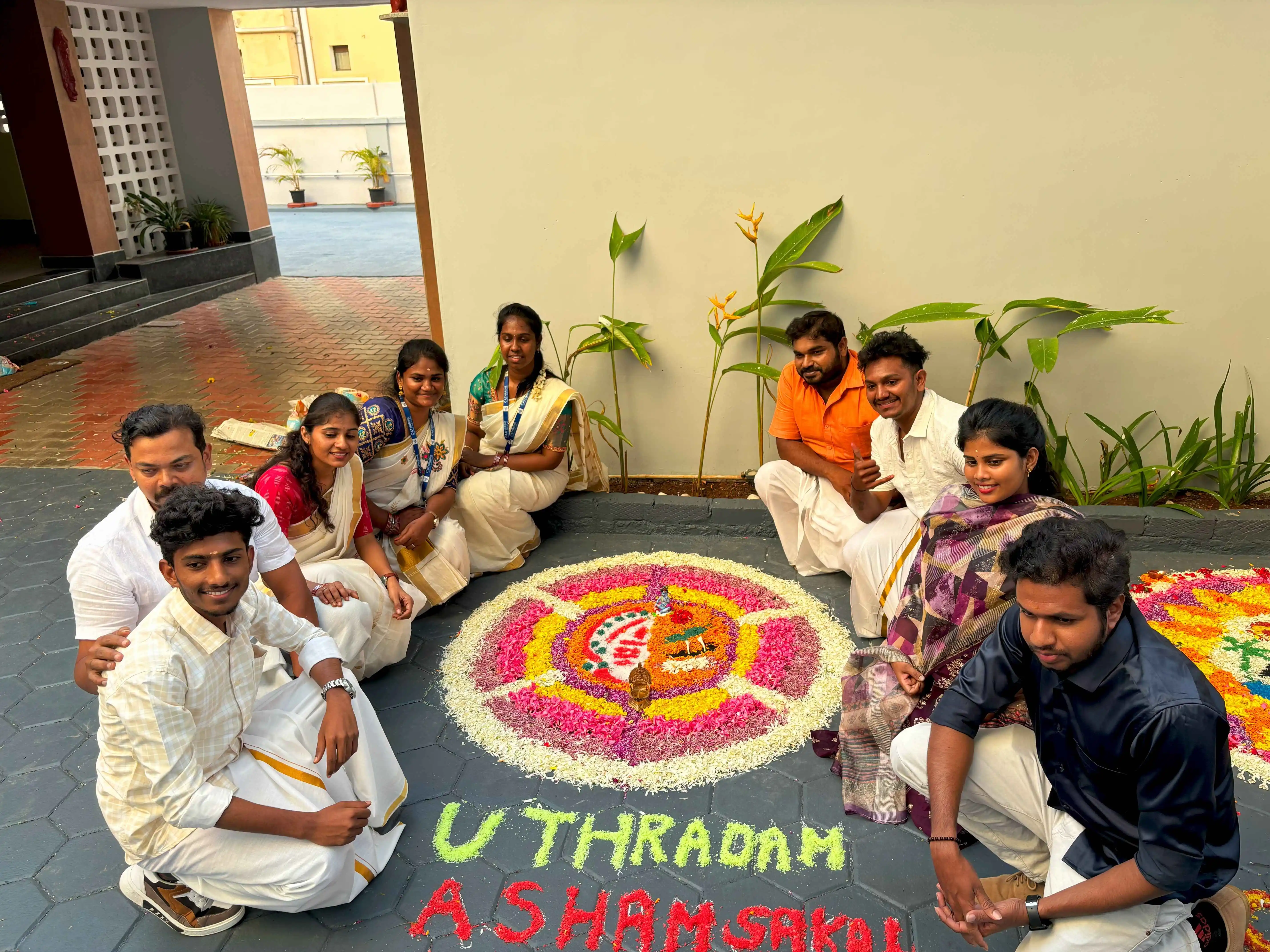 Photo with beautiful Rangoli design during Onam festival