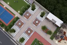 Best Residential Plot With Play Area Near Tirupur, Coimbatore Aerial view of a modern outdoor area with a tennis court, jogging track, seating, and greenery.